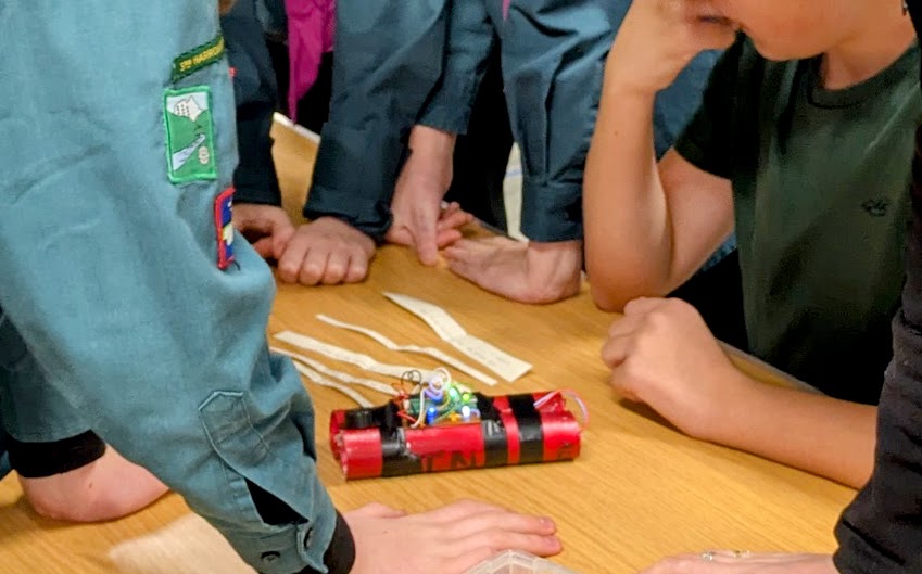 Scouts working on solving the clues.