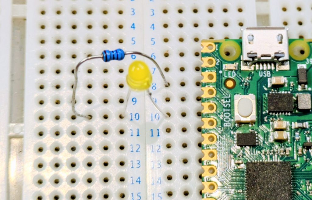 LED and resistor shown in the correct place against a Pi Pico